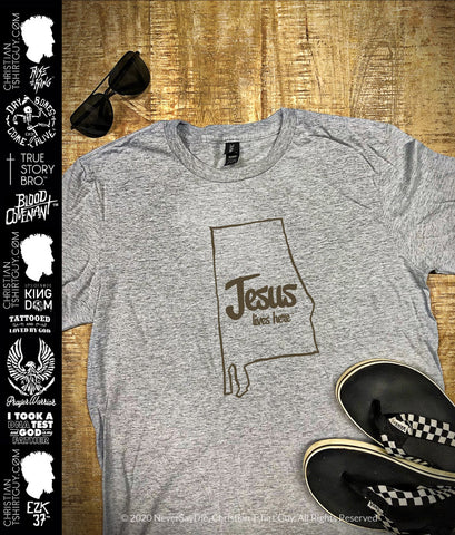 Jesus lives here⢠- United State of Alabama | Christian T-Shirt
